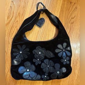Donald Pliner black handbag with flower detail